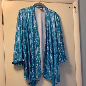 Silky, ruffled open cardigan top.